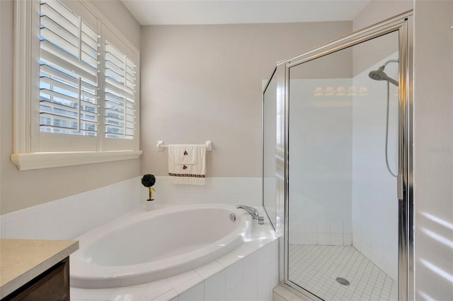 bathroom featuring vanity and separate shower and tub