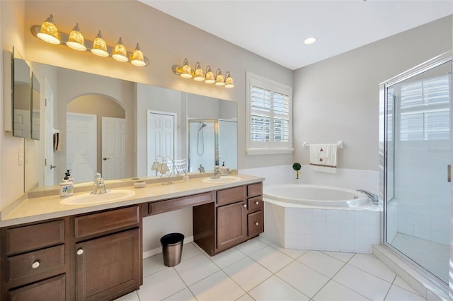 bathroom with vanity, tile patterned floors, and separate shower and tub