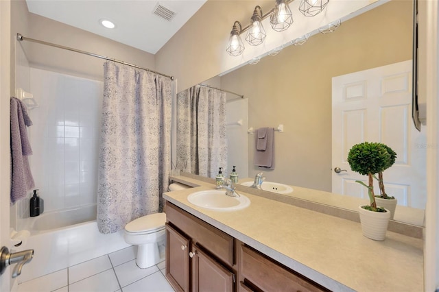 full bathroom with tile patterned floors, vanity, toilet, and shower / bath combination with curtain