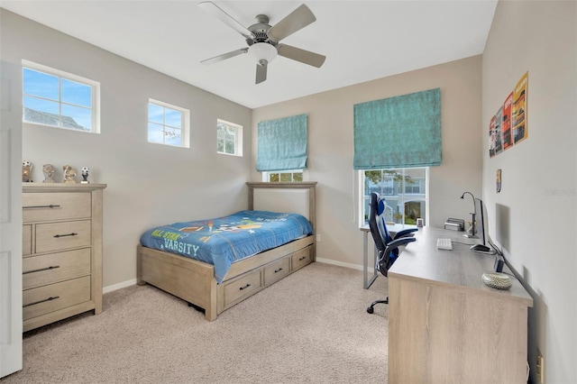 bedroom featuring light carpet and ceiling fan