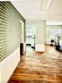 hall with hardwood / wood-style floors