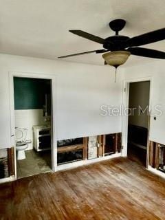 unfurnished living room featuring hardwood / wood-style floors, a fireplace, and ceiling fan