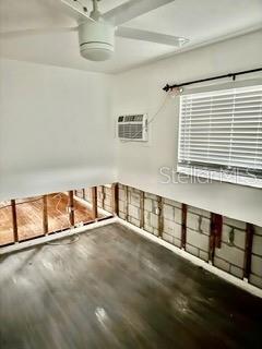 garage featuring a wall mounted AC