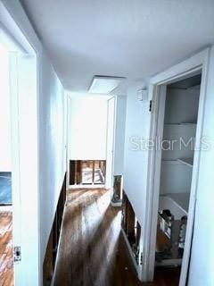 hallway featuring dark hardwood / wood-style floors