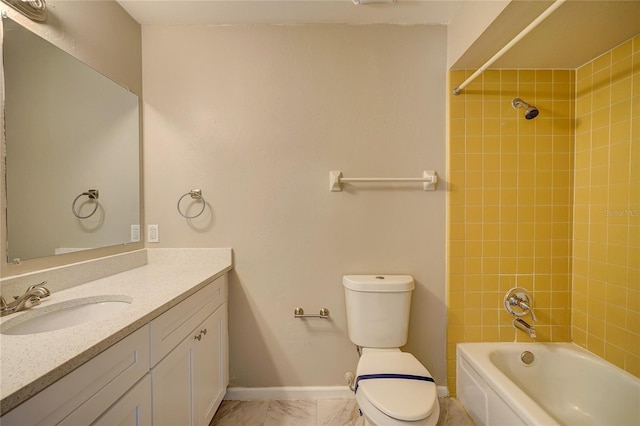 full bathroom with toilet, tiled shower / bath, and vanity