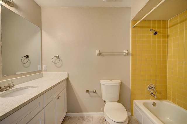 full bathroom featuring tiled shower / bath combo, vanity, and toilet