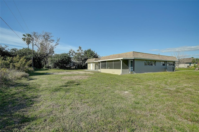 view of yard featuring cooling unit and a sunroom