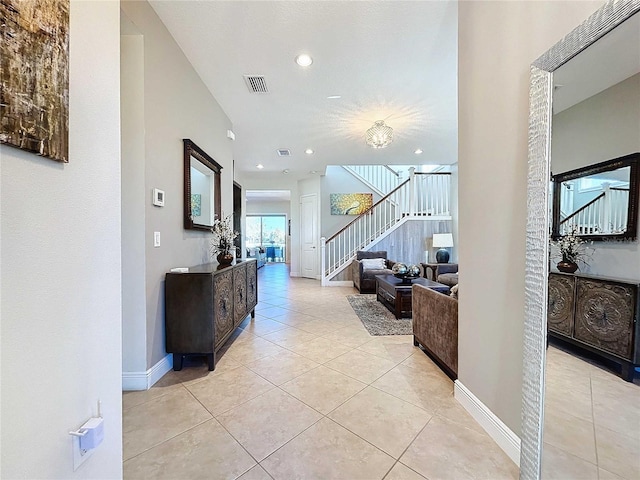 hall with light tile patterned flooring