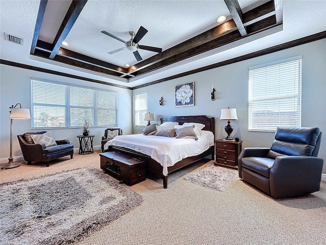 bedroom with ceiling fan, a raised ceiling, a textured ceiling, and carpet