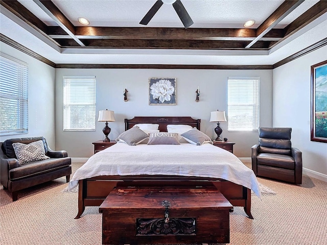 bedroom with light carpet, a tray ceiling, ornamental molding, and ceiling fan