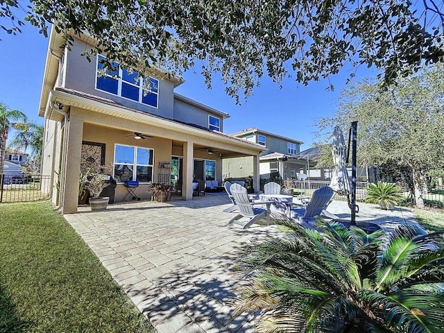 back of house featuring a patio area and ceiling fan