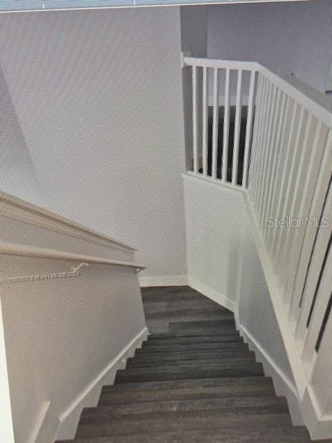 stairway with wood-type flooring