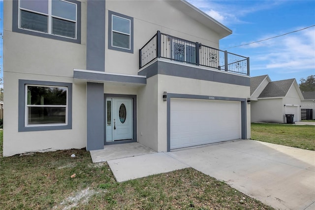 view of front of home featuring a garage and a front yard