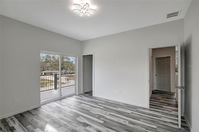 spare room with light wood-type flooring