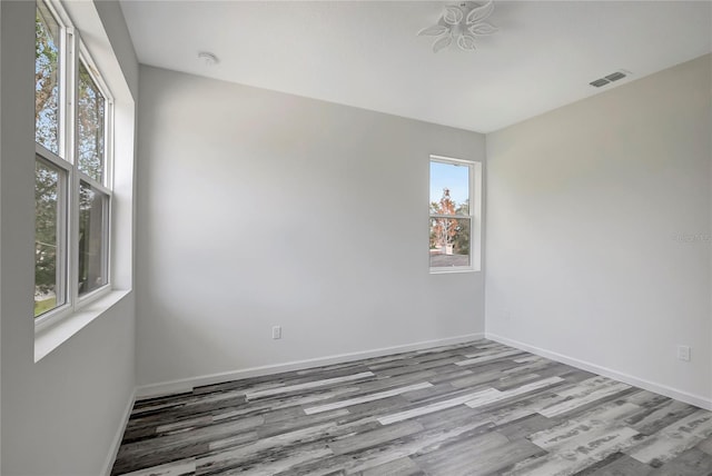 spare room with light hardwood / wood-style flooring