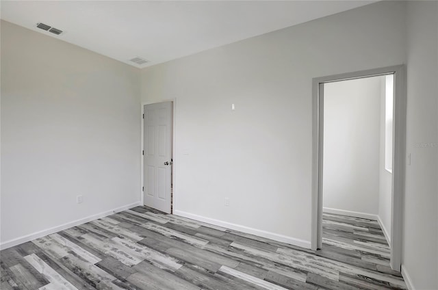 unfurnished room featuring light wood-type flooring