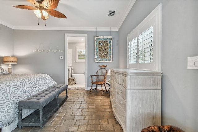 bedroom with ceiling fan, crown molding, and ensuite bath