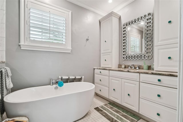 bathroom featuring a washtub, tile patterned flooring, vanity, and ornamental molding