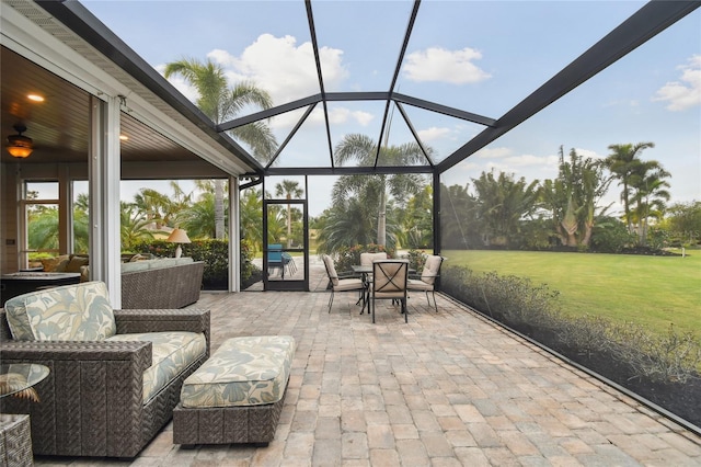 view of patio / terrace featuring glass enclosure