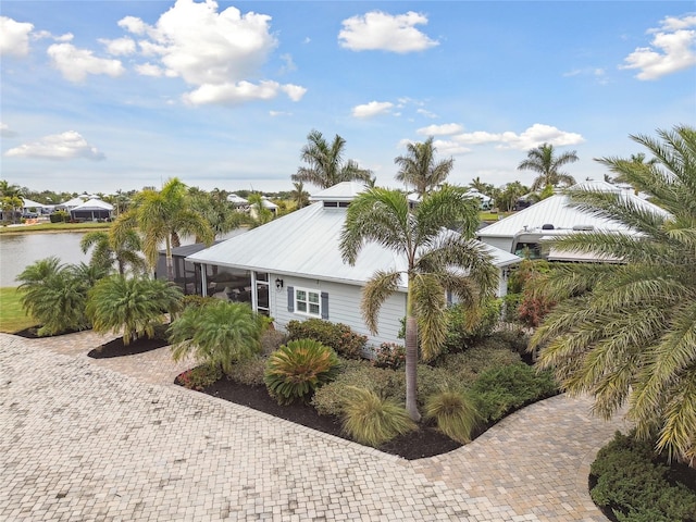 view of property exterior with a water view