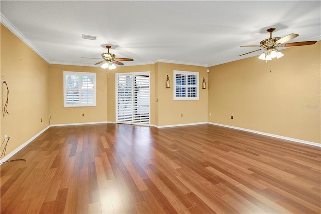 unfurnished room featuring ceiling fan, ornamental molding, and light wood-type flooring