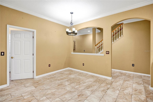 unfurnished room featuring a notable chandelier and ornamental molding