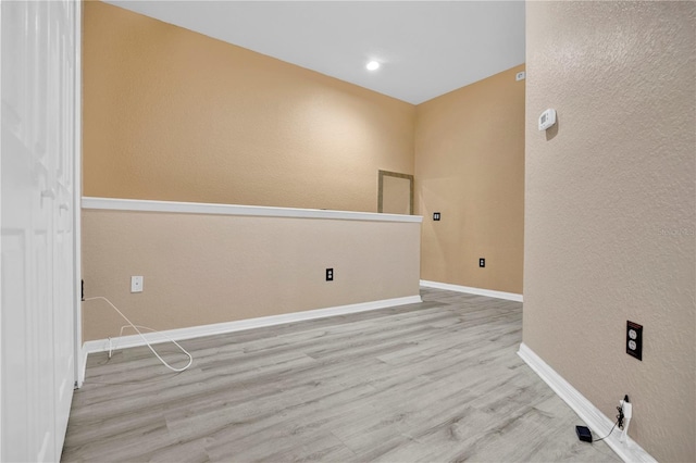 spare room with light wood-type flooring