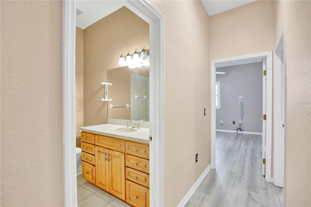 bathroom featuring hardwood / wood-style flooring and vanity