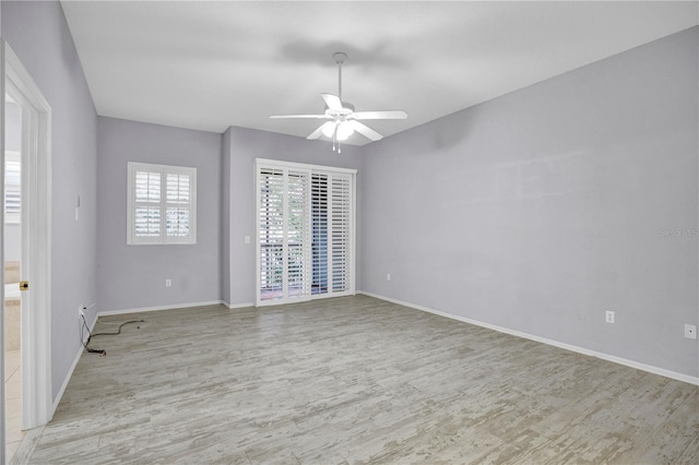 spare room with light hardwood / wood-style floors and ceiling fan