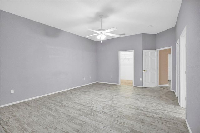 unfurnished room featuring ceiling fan and light hardwood / wood-style flooring