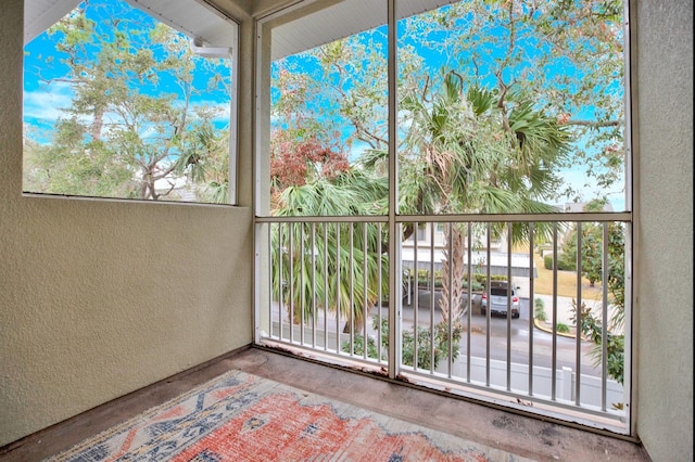 unfurnished sunroom with plenty of natural light