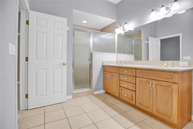 bathroom with a shower with shower door, tile patterned floors, vanity, and a chandelier