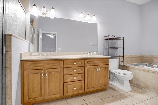 full bathroom featuring vanity, toilet, ceiling fan, and tile patterned floors