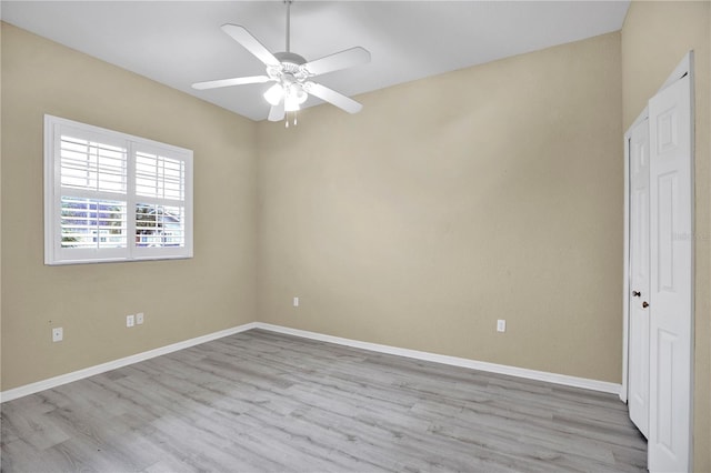 unfurnished room with ceiling fan and light hardwood / wood-style flooring