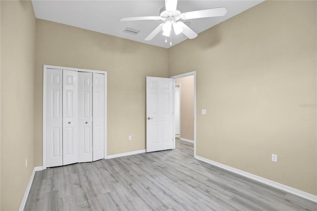 unfurnished bedroom featuring ceiling fan, a closet, and light hardwood / wood-style flooring