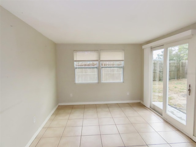 empty room with light tile patterned flooring