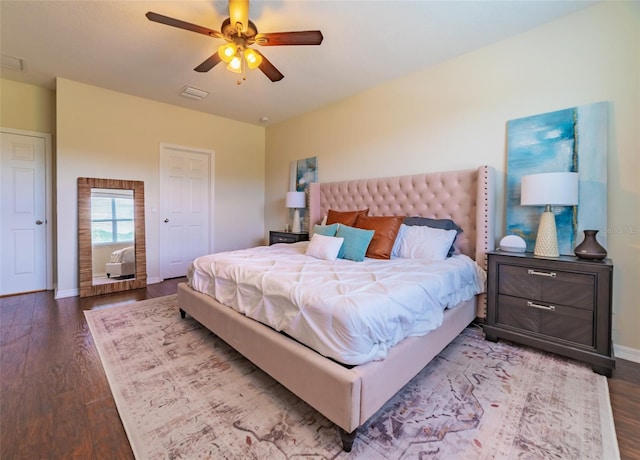 bedroom with ceiling fan and wood-type flooring