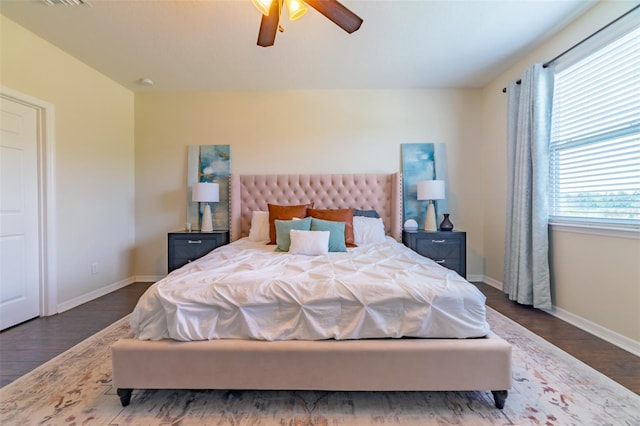 bedroom with ceiling fan and dark wood-type flooring