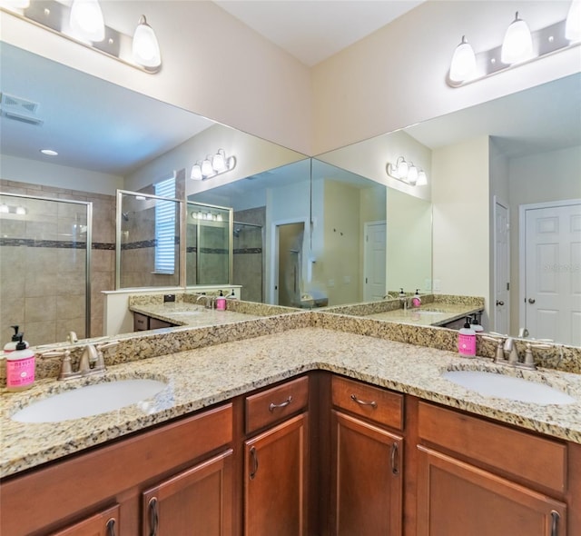 bathroom with vanity and walk in shower