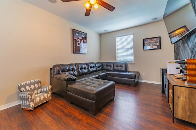 living room with dark hardwood / wood-style floors and ceiling fan