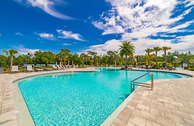 view of swimming pool with a patio area