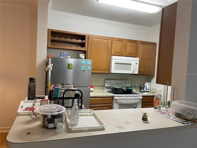 kitchen with white appliances and ornamental molding