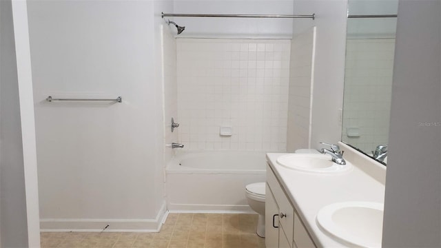 full bathroom featuring toilet, vanity, and tiled shower / bath