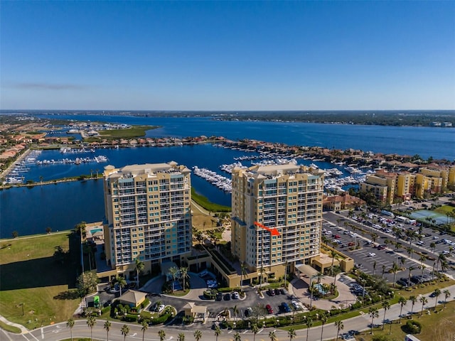 birds eye view of property with a water view