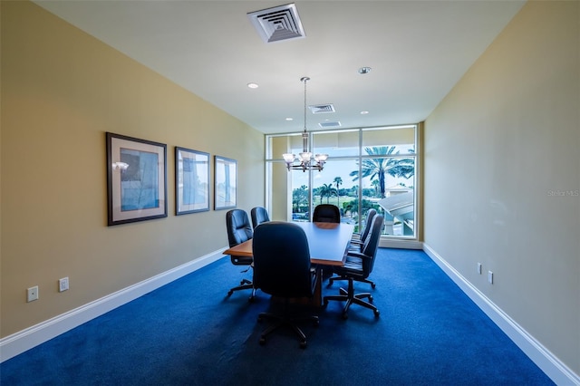 dining space with a notable chandelier and a wall of windows