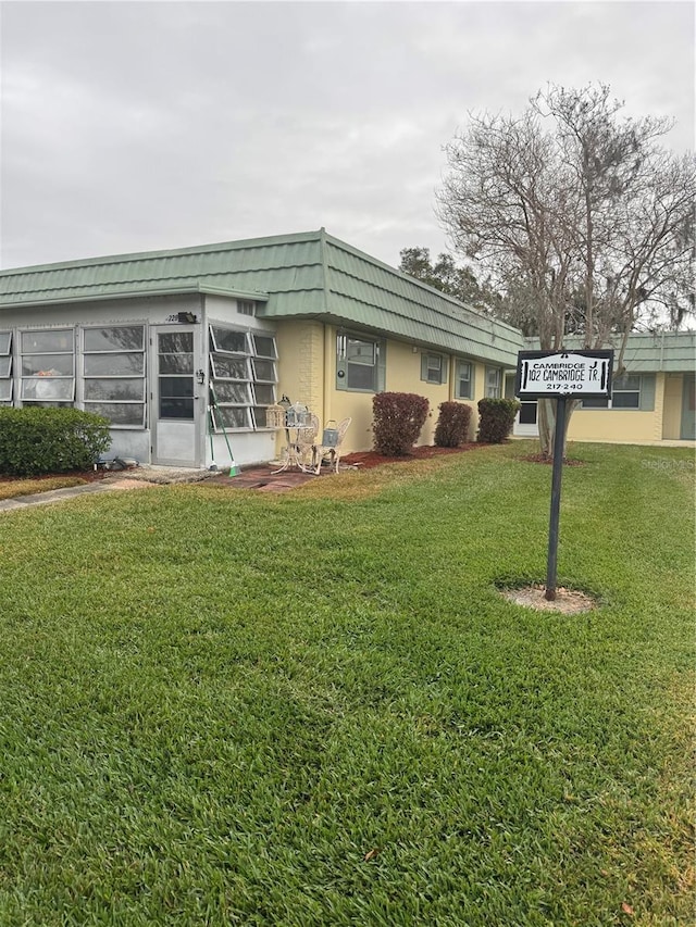 exterior space with a front lawn