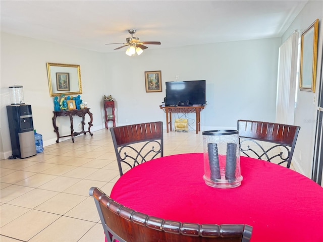 tiled dining room with ceiling fan