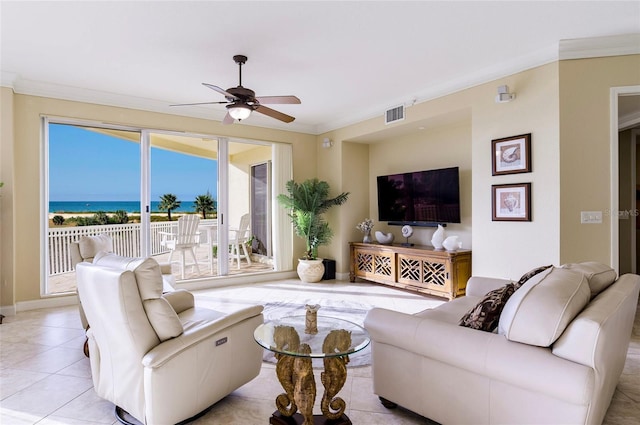 living room with ceiling fan, a water view, ornamental molding, and light tile patterned flooring