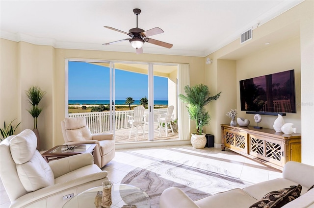 living room featuring crown molding, light tile patterned floors, and ceiling fan