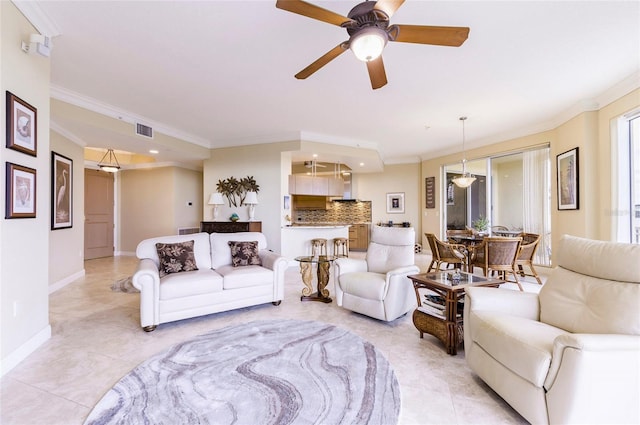 tiled living room featuring ceiling fan and crown molding